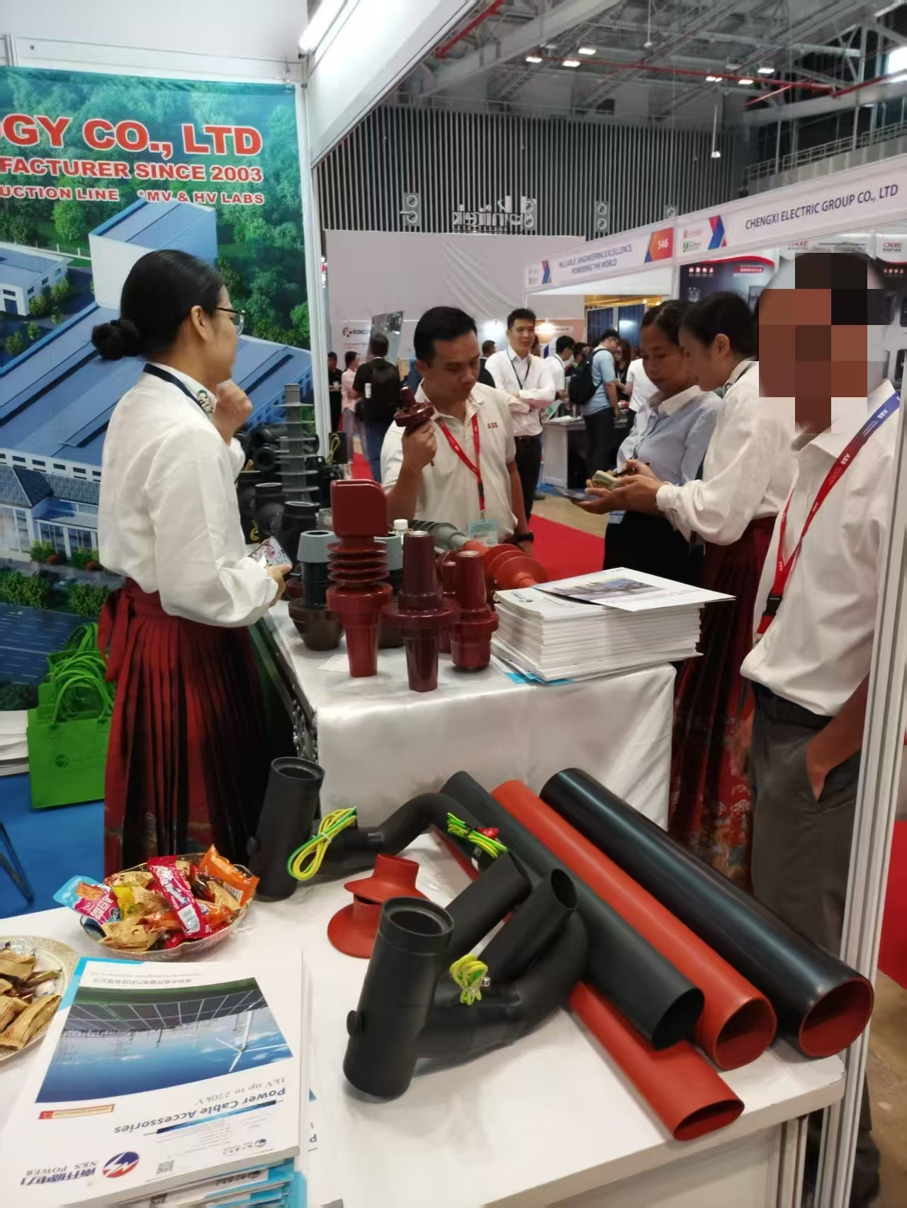 Customers come to the booth to inquire